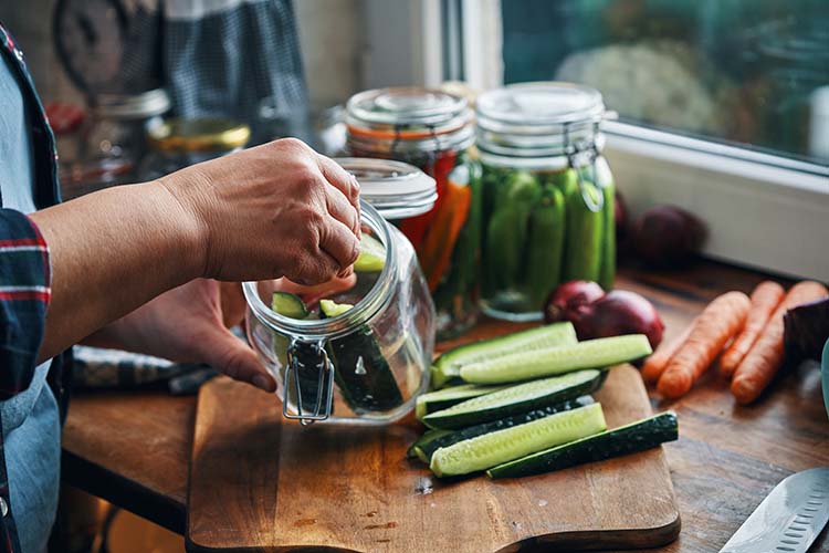 Someone canning vegetables from their garden